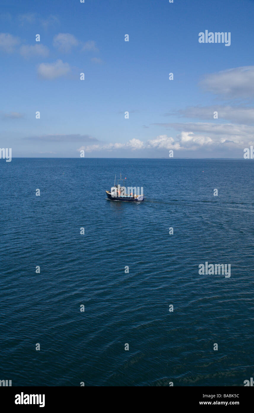 Fishing Boat at sea near Trefor Pier, North Wales Stock Photo