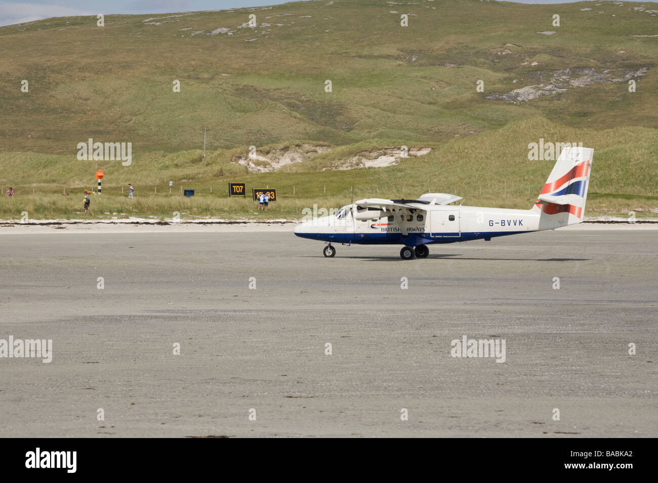 United Kingdom Scotland GB Barra Outer Hebrides Airport aerodrome beach landing strip Twin otter landing Stock Photo