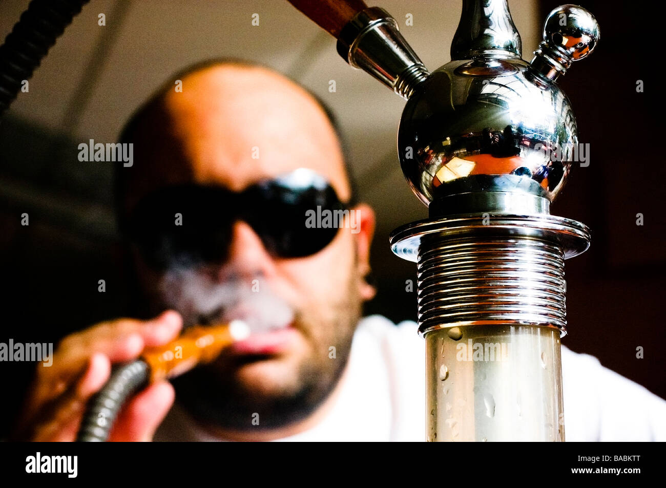 man smoking in a water pump Stock Photo Alamy