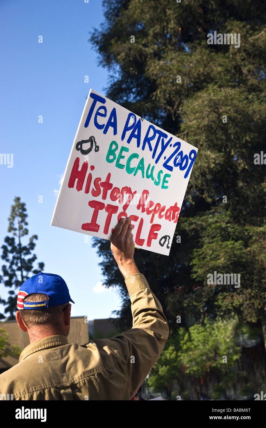 Rear view of man with raised sign, Tea Party 2009. Stock Photo