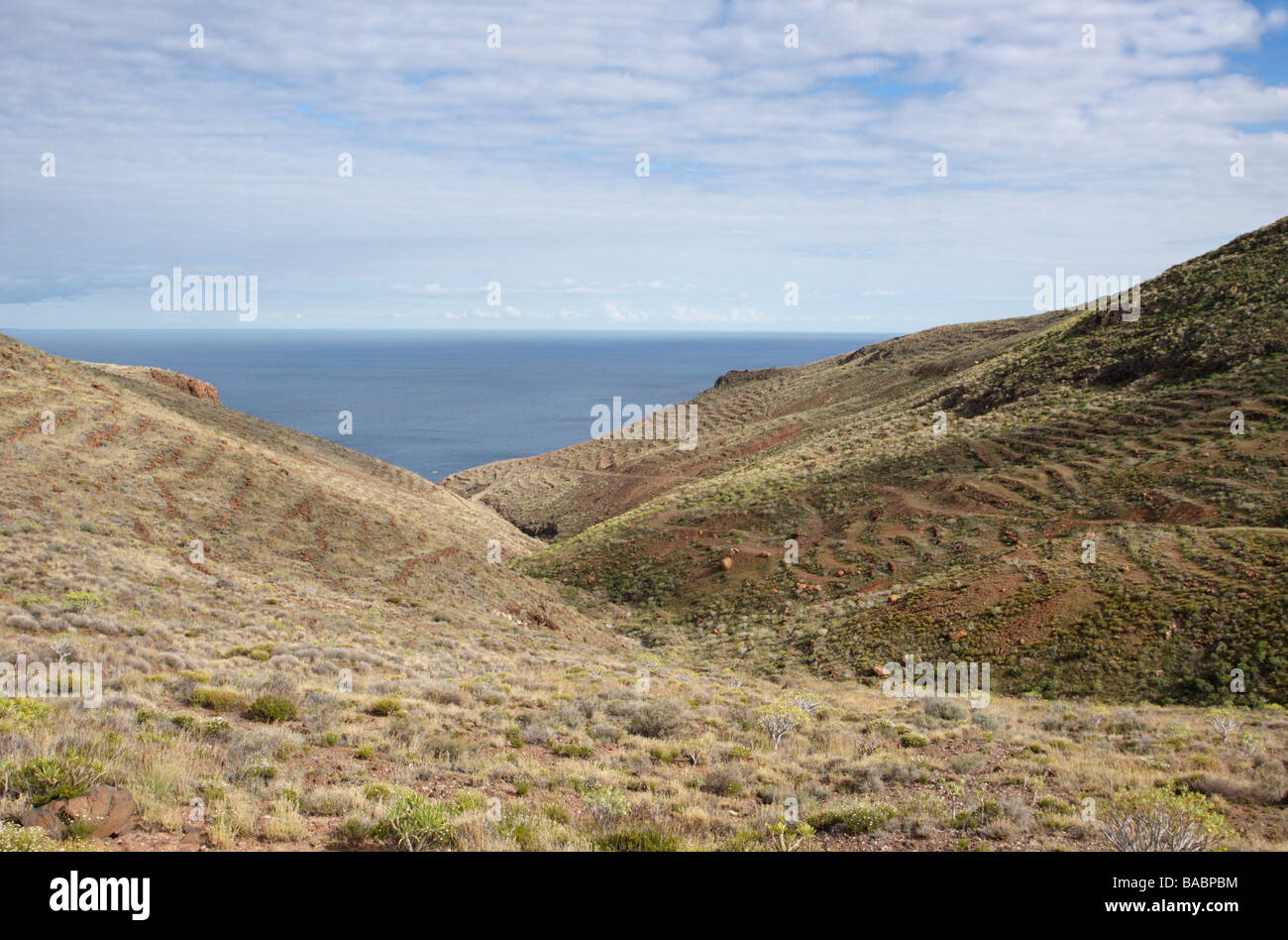 Coastal area near San Sebastian de la Gomera. A small boat bobs in the water. Stock Photo