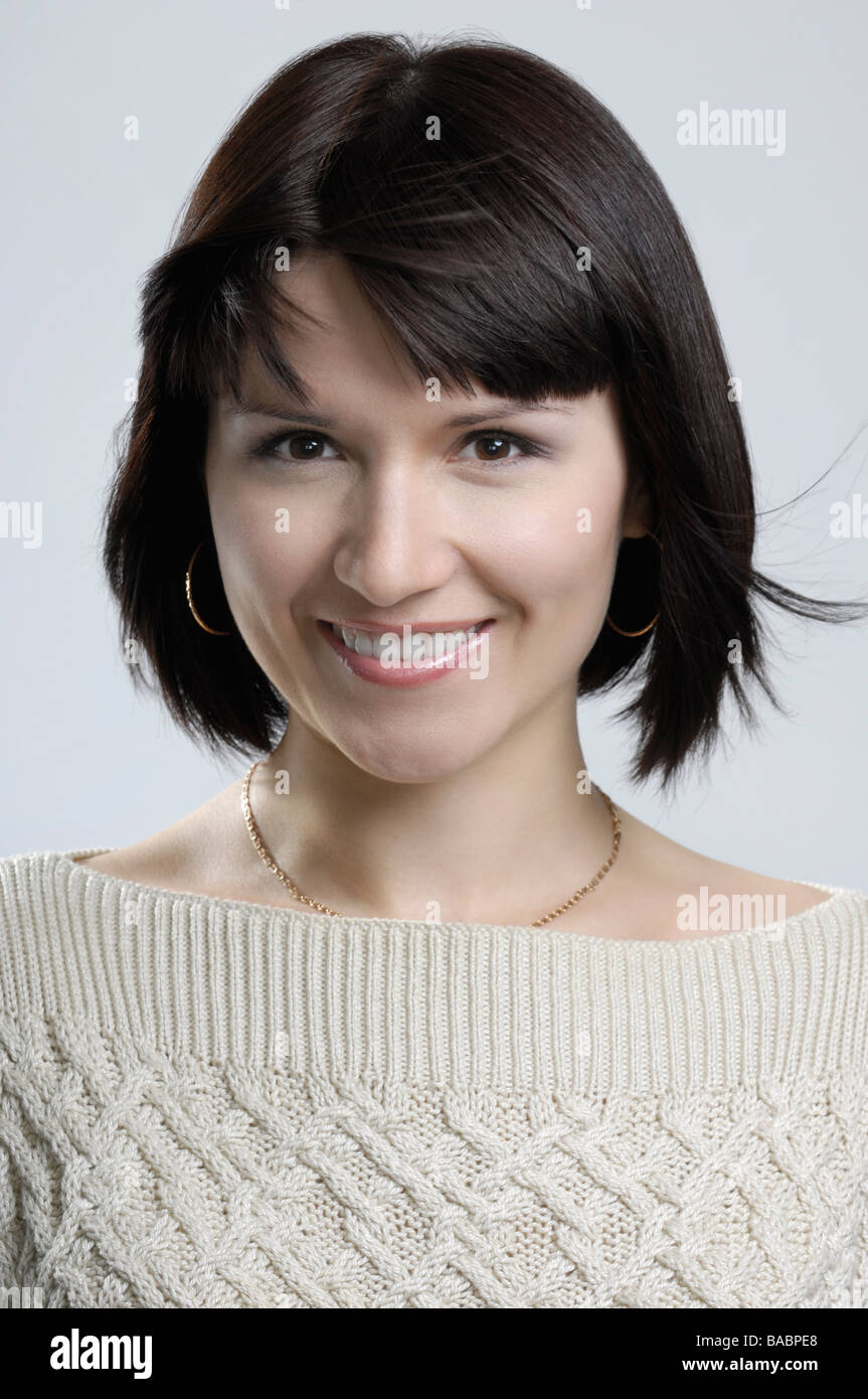 Portrait of smiling young woman Stock Photo