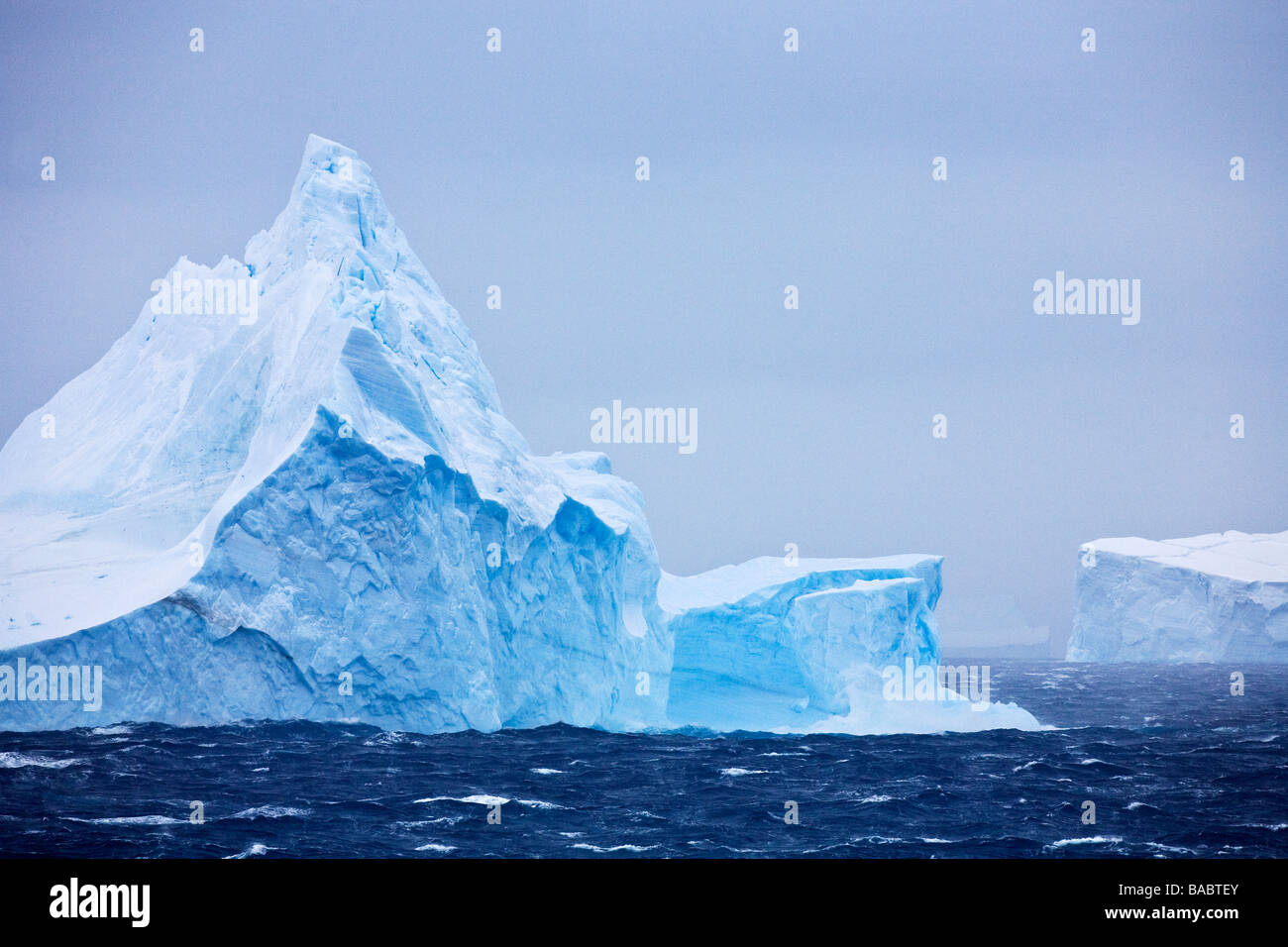 Blue iceberg in stormy seas Weddell Sea Antarctica Stock Photo