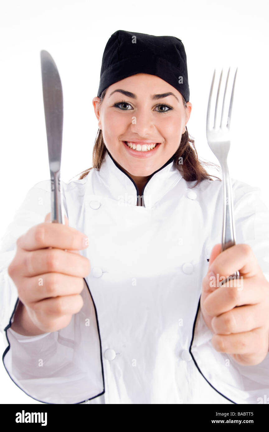smiling female chef showing fork Stock Photo Alamy