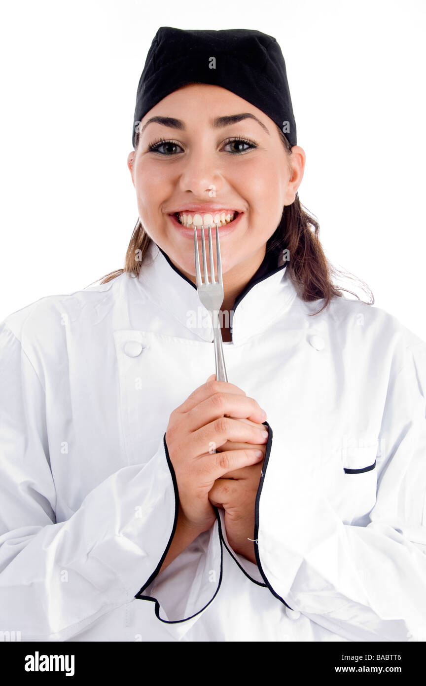 smiling female chef showing fork Stock Photo Alamy