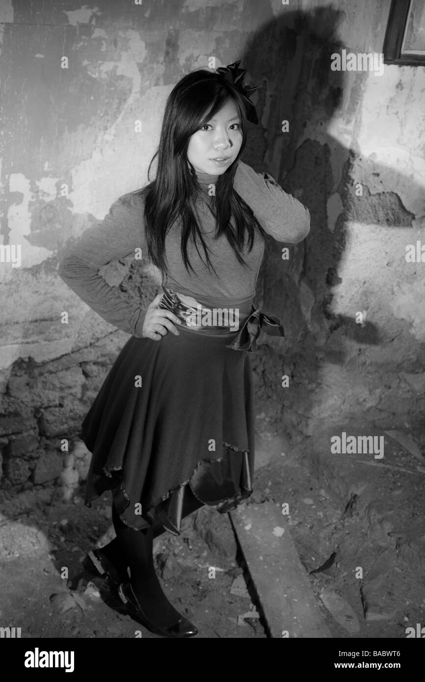 beautiful asian girl posing in abandoned castle Stock Photo