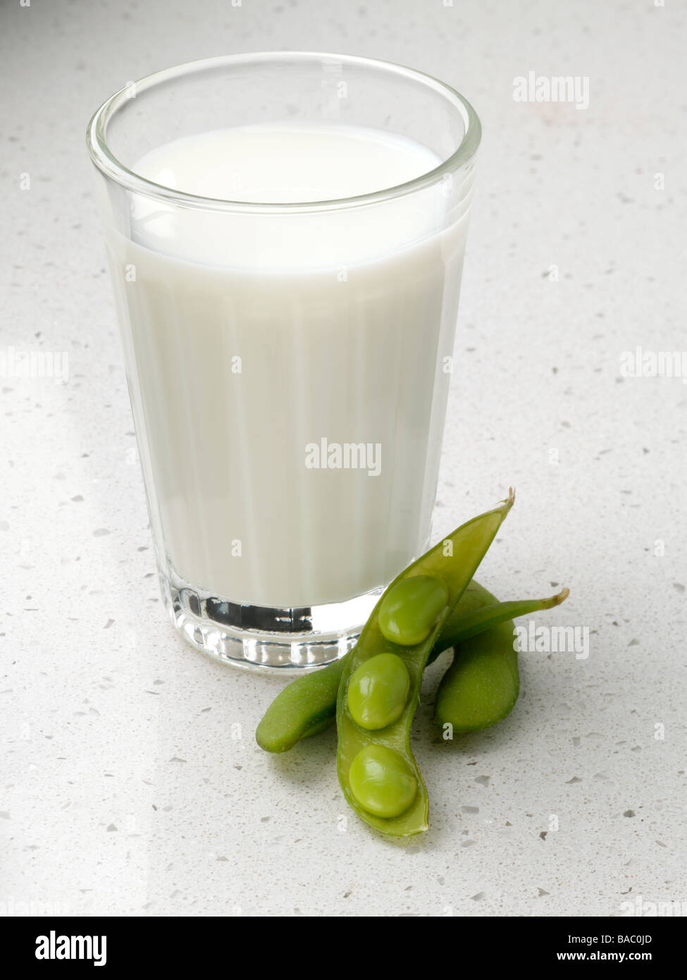 A glass of soya milk and Edamame beans Stock Photo Alamy