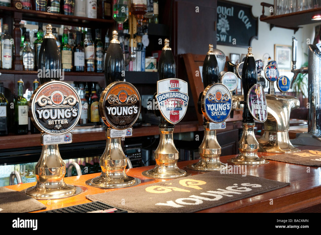 Row of traditional English bitter beer pumps in pub, London England UK Stock Photo