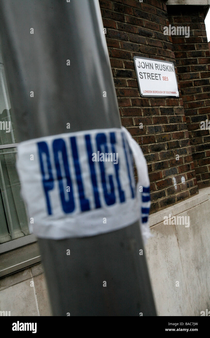 Police tape on a lamppost on John Ruskin street in Walworth, south