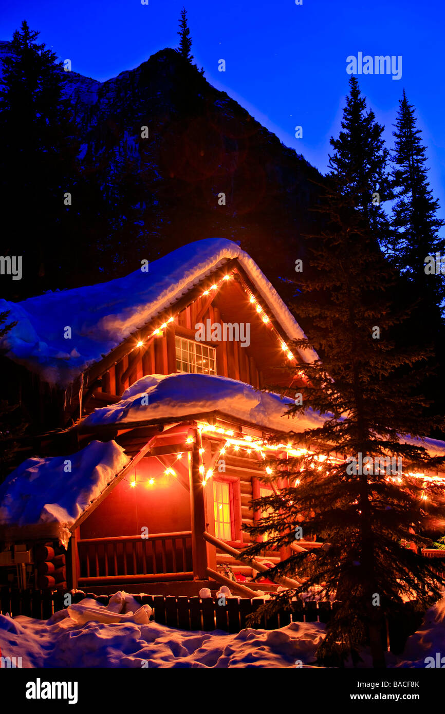 Log cabin covered in snow near Lake Louise. Stock Photo