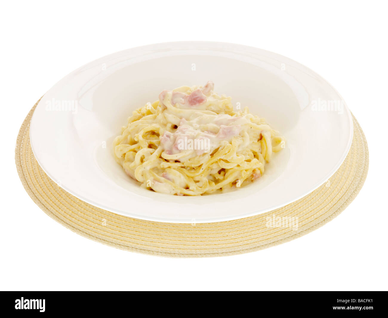 Freshly Prepared Italian Style Spaghetti Pasta With A Creamy Carbonara Sauce Isolated Against A White Background With No People And A Clipping Path Stock Photo