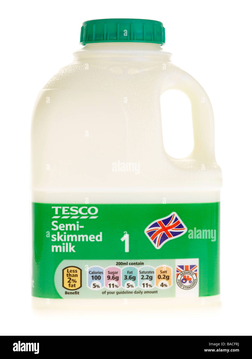 Tesco Branded Plastic Pint Bottle Of Semi Skimmed Milk Isolated Against A White Background With No People And A Clipping Path Stock Photo