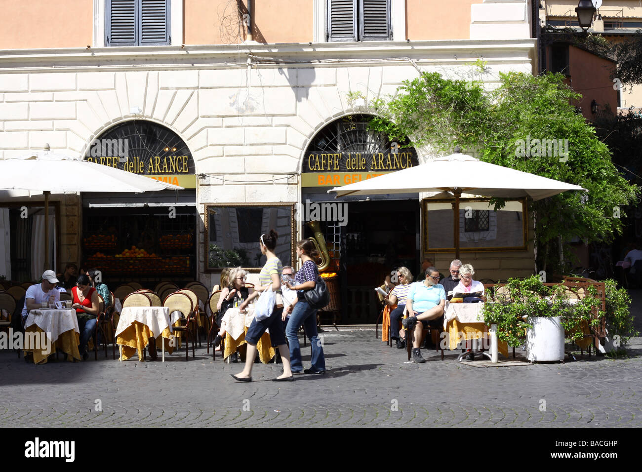 Tourists at a bar on Santa Maria in Trastevere square, Rome, Italy. Stock Photo