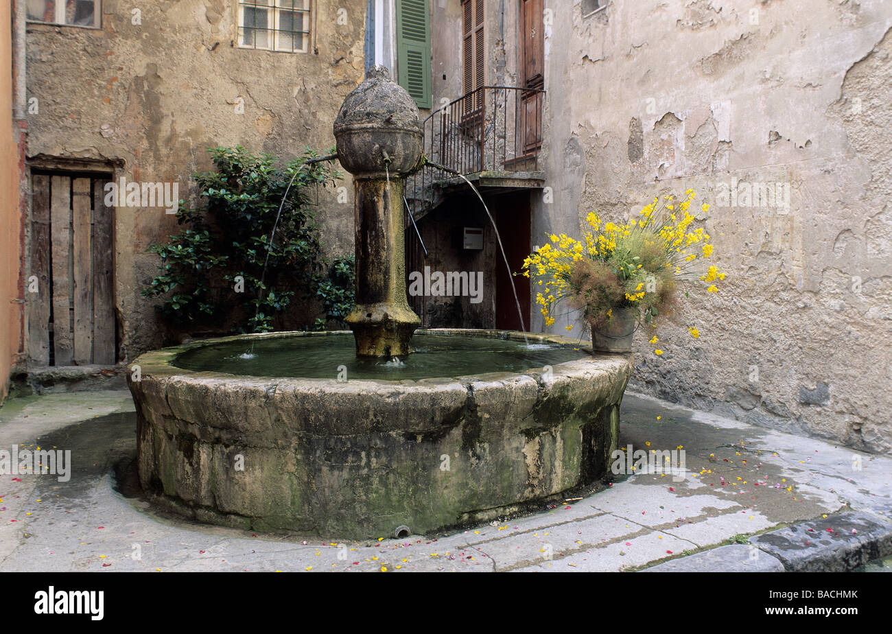 France, Alpes Maritimes, Sospel, detail of a fountain and houses Stock Photo