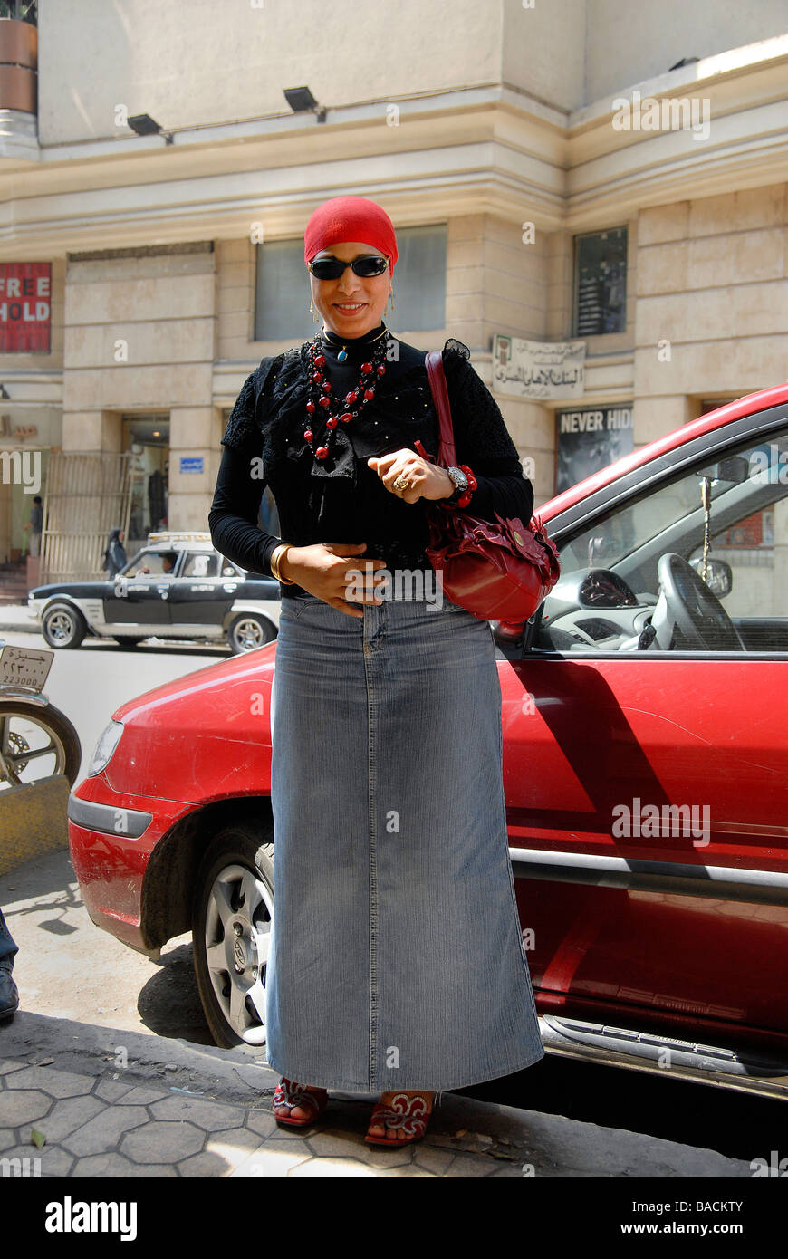 An Egyptian woman is posing for the camera in Downtown Cairo. Egyptian