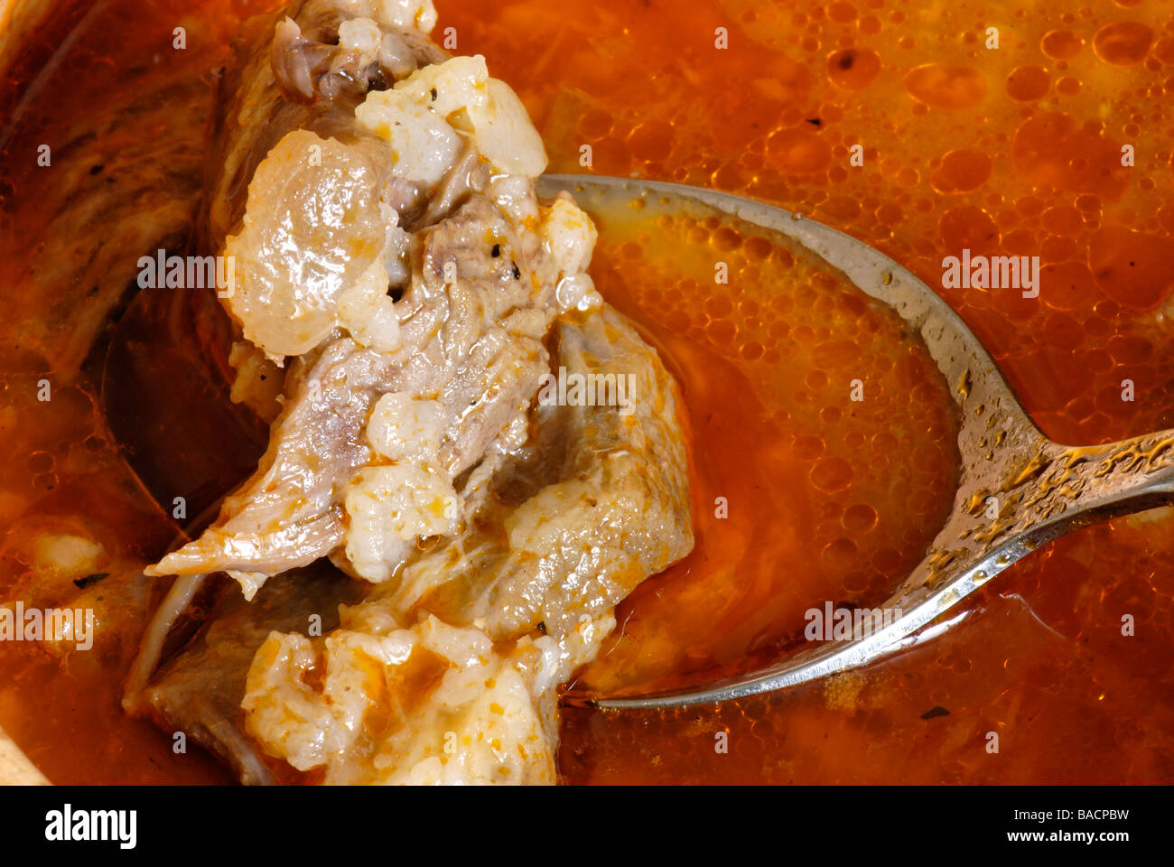 Cooked meat in spoon Stock Photo Alamy