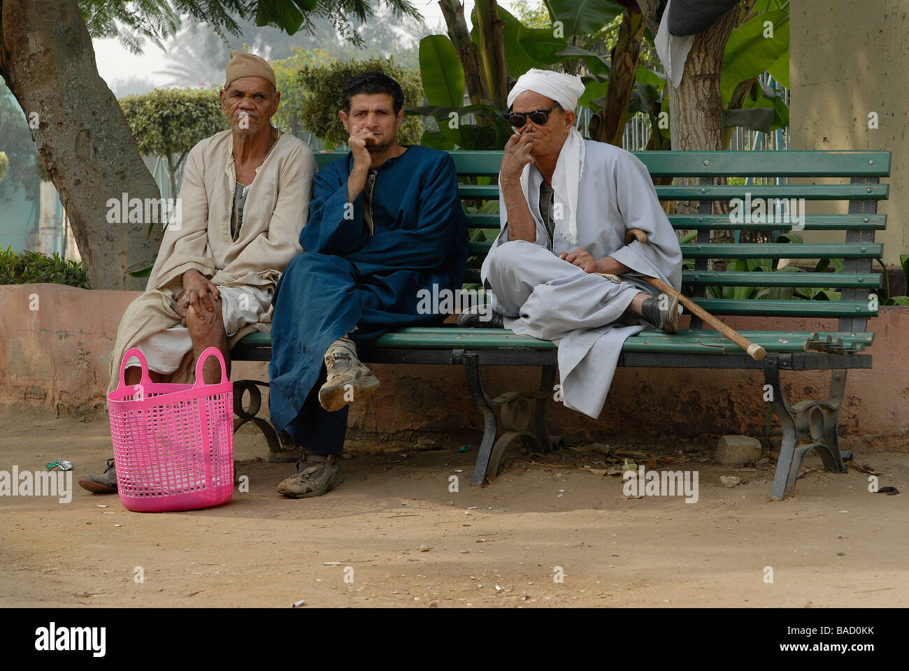 Three leprosy patients in Egypt's leprosy colony Abu Zaabal are chilling in the hospital garden Stock Photo