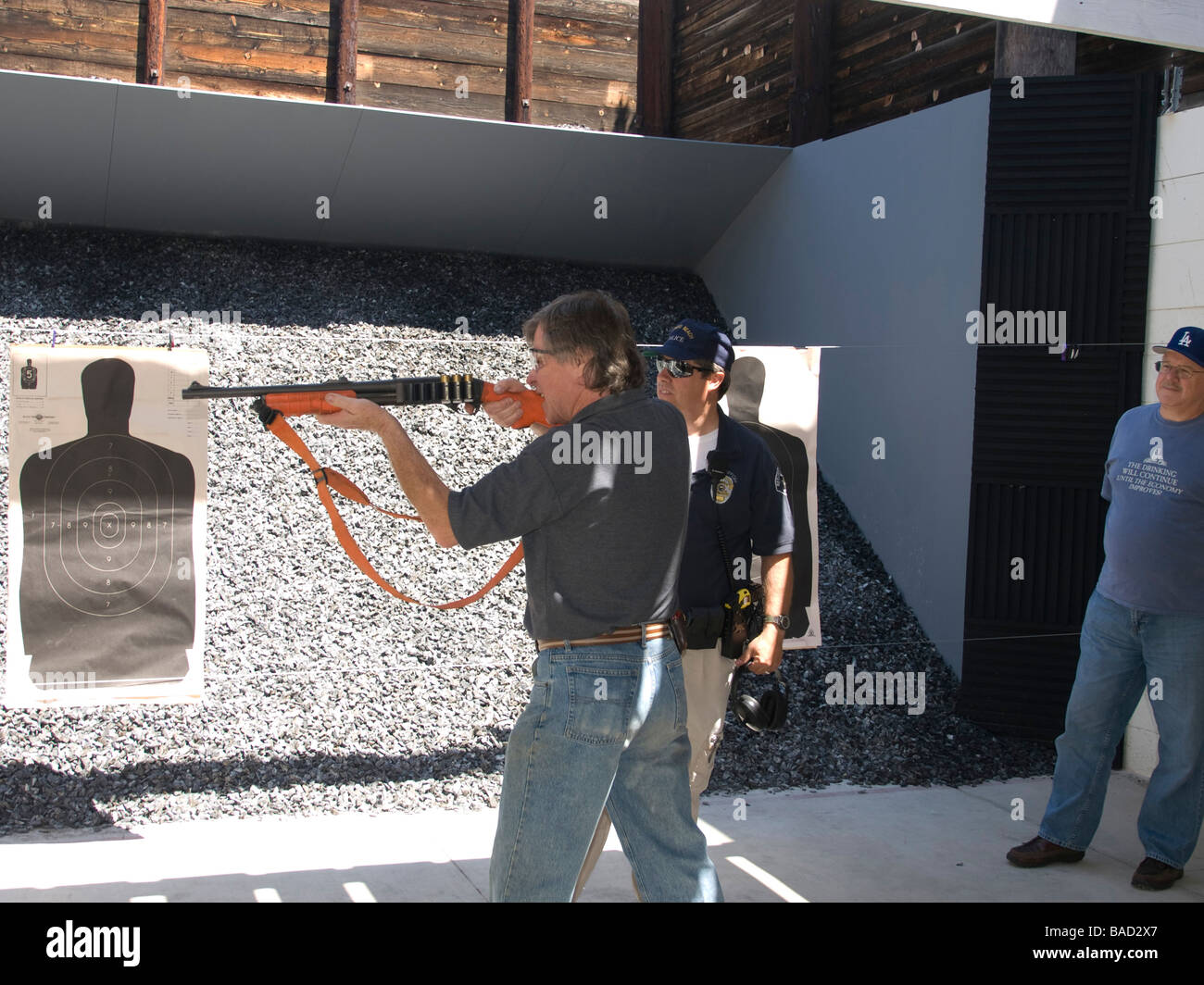 Member of the citizen police academy fires non lethal bean bag 12 guage