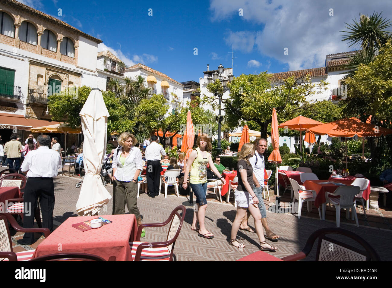 Marbella Malaga Province Costa del Sol Spain Tourists enjoying the sunshine in the Orange Square in the old town Stock Photo