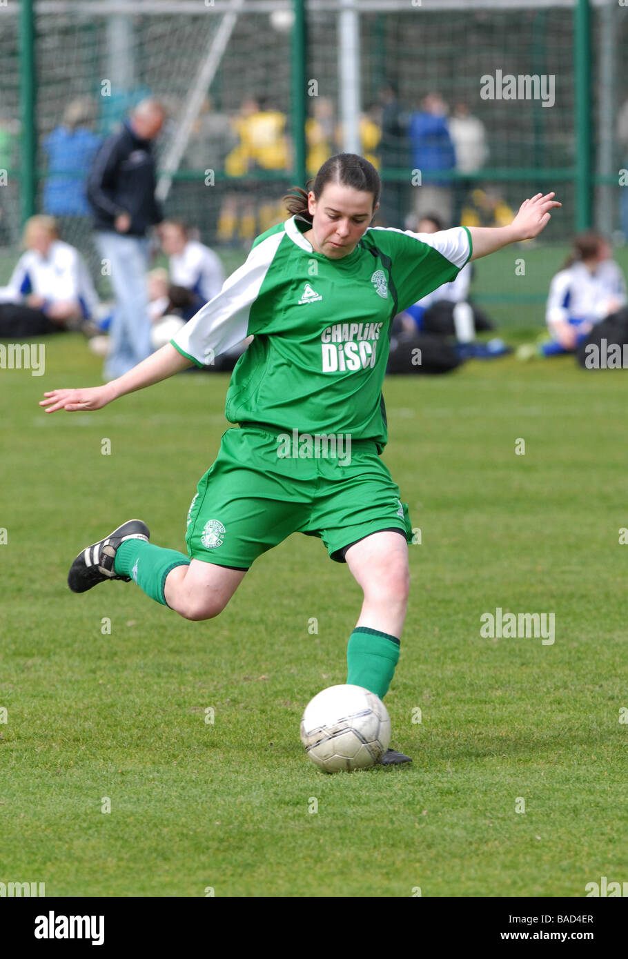 Young female footballer in action Stock Photo