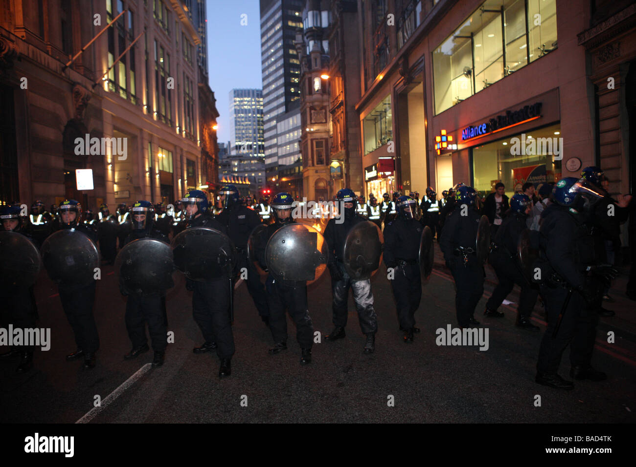 Police riot line at g20 riots, with fire in background Stock Photo