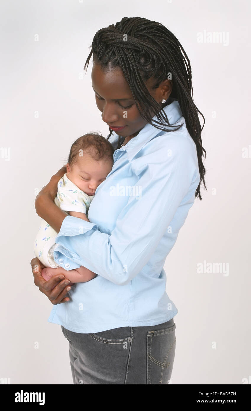 Woman lovingly holding baby hi-res stock photography and images - Alamy