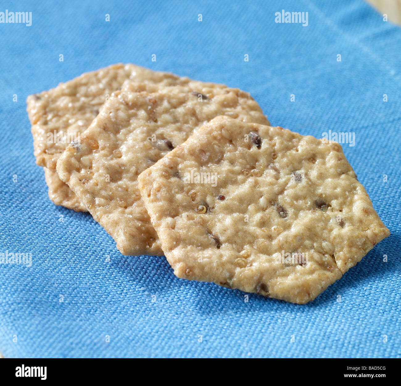 Multi grain crackers on a blue background Stock Photo