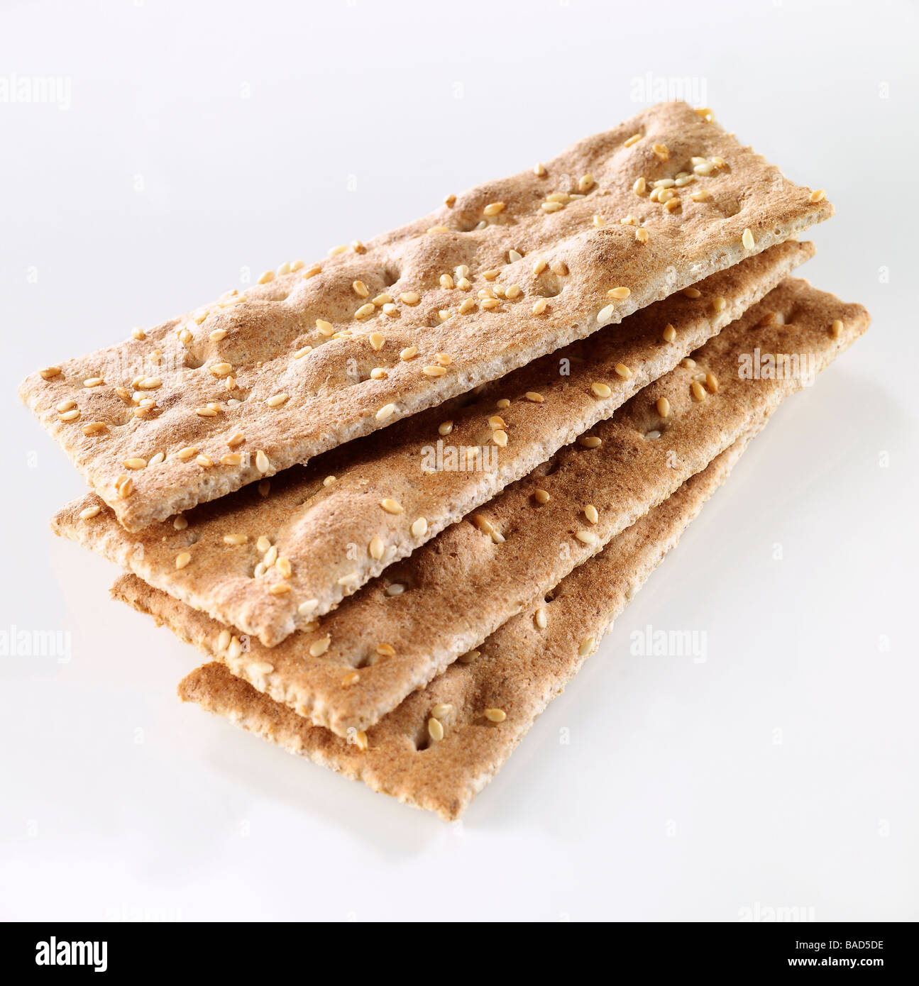 Wheat Sesame Crackers on white. Stock Photo