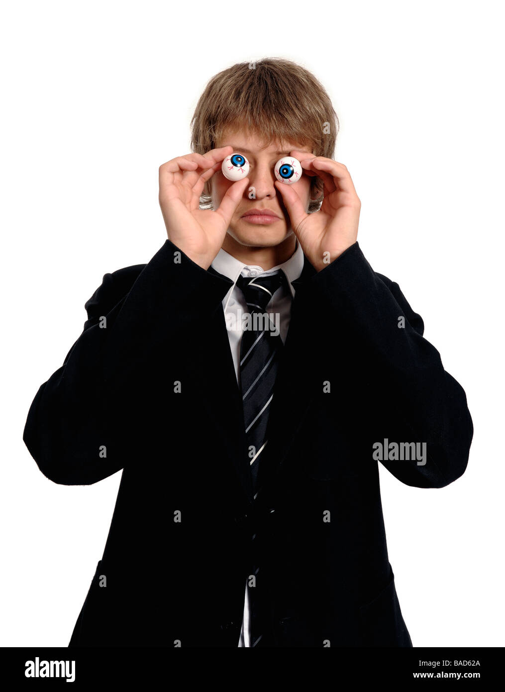 Schoolboy holding joke eyes Stock Photo