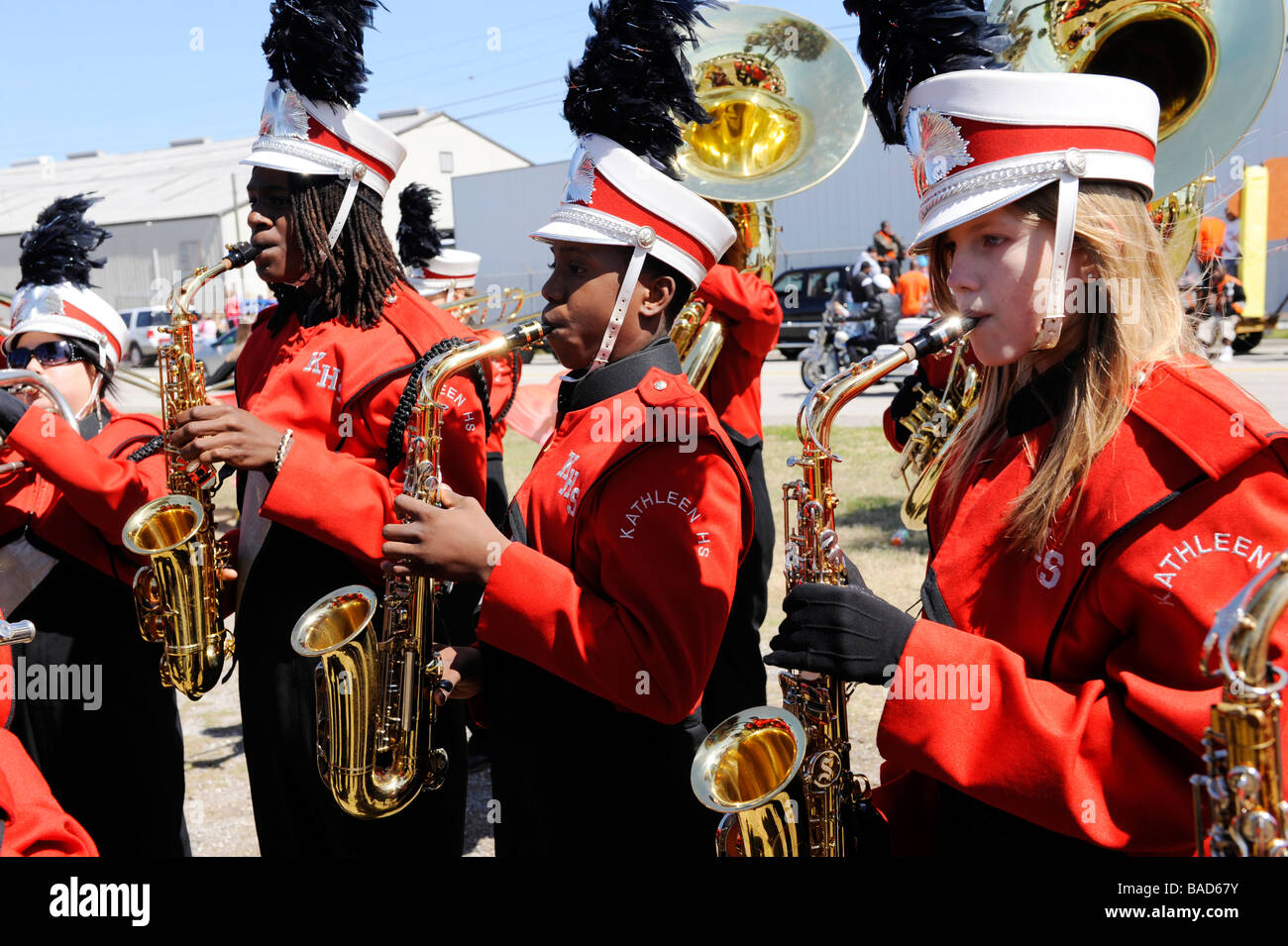 High School Band Members play saxophones at Strawberry Festival Parade Plant City Florida Stock Photo