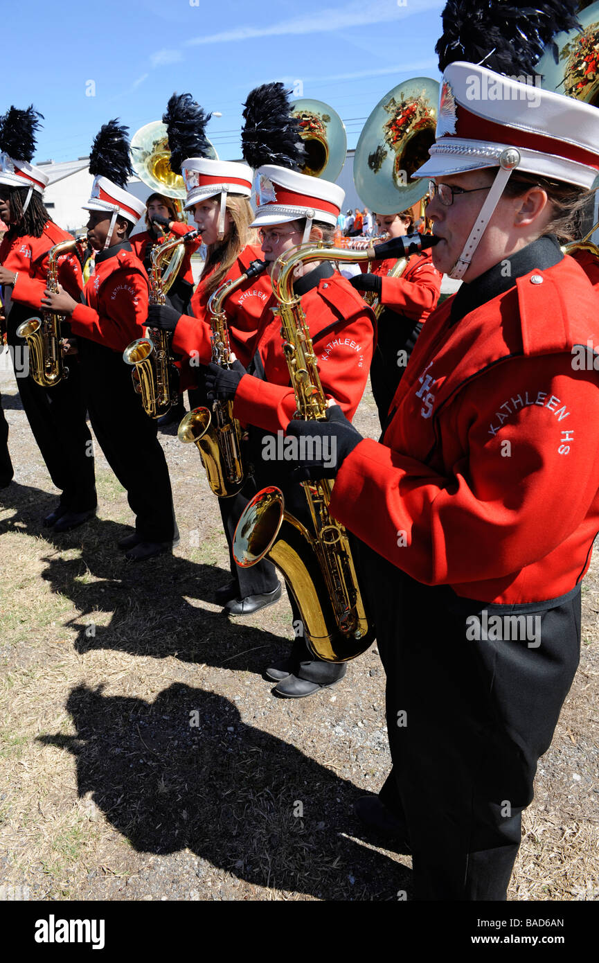 High School Band Members play saxophones at Strawberry Festival Parade Plant City Florida Stock Photo