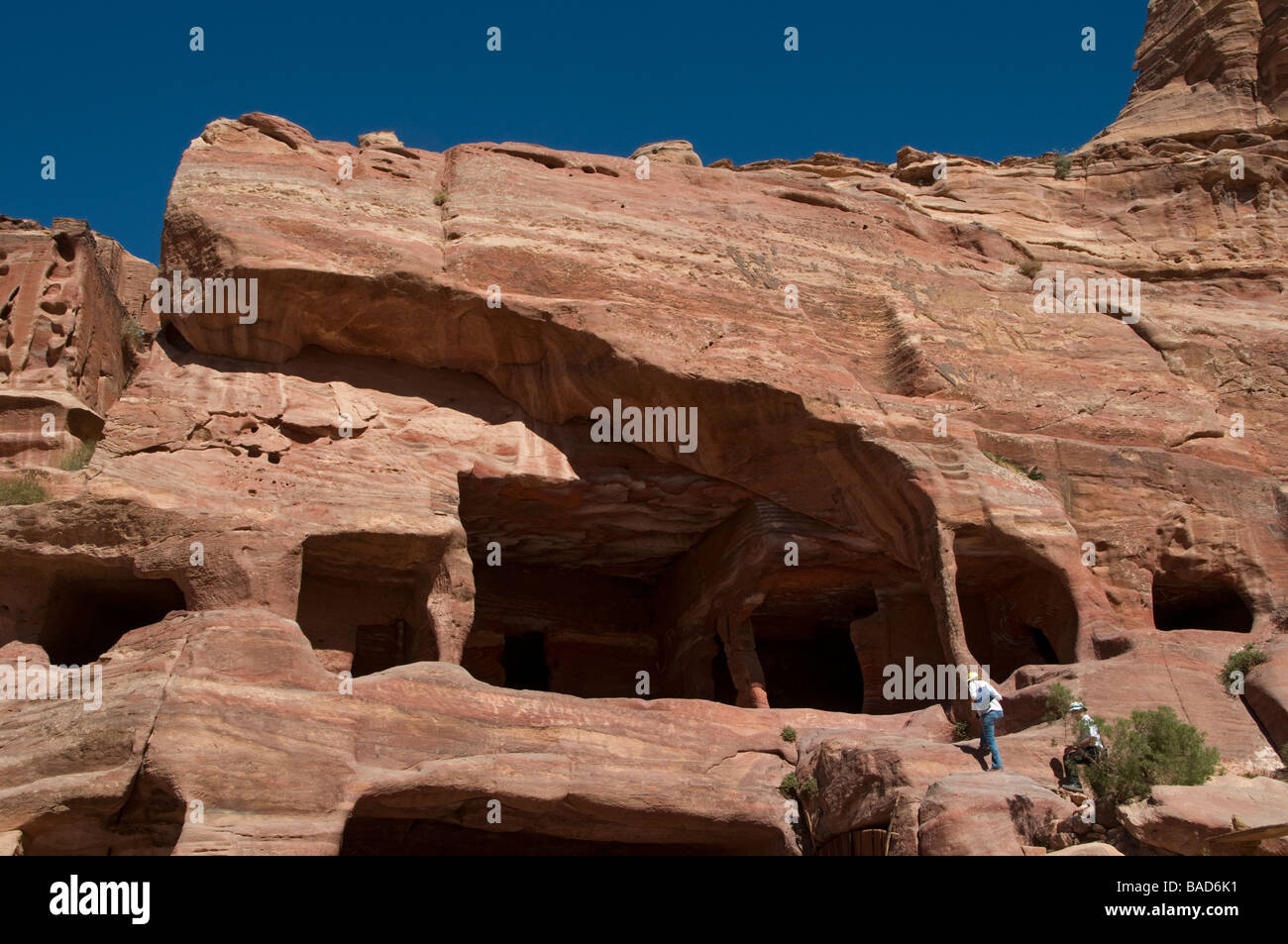 Nabatean tombs carved into a cliff face in the ancient Nabatean city of ...