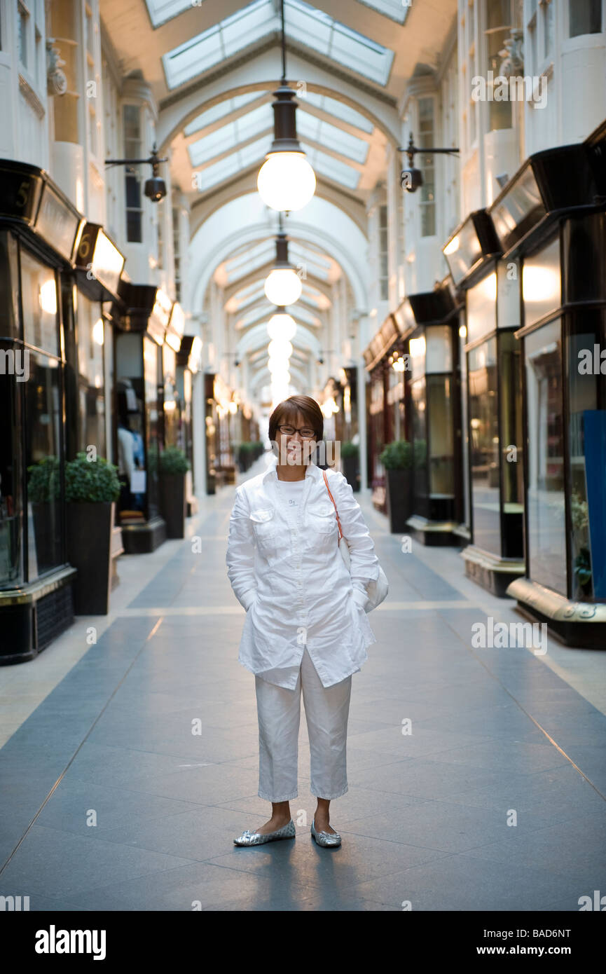 A woman at a shopping arcade in London England. Stock Photo