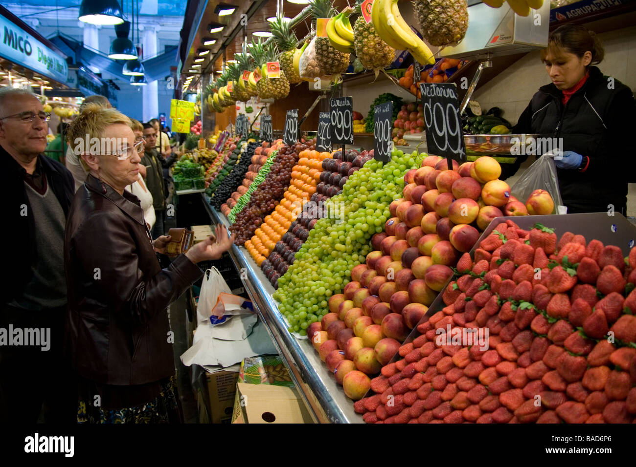 People buying fresh fruit from stall Stock Photo