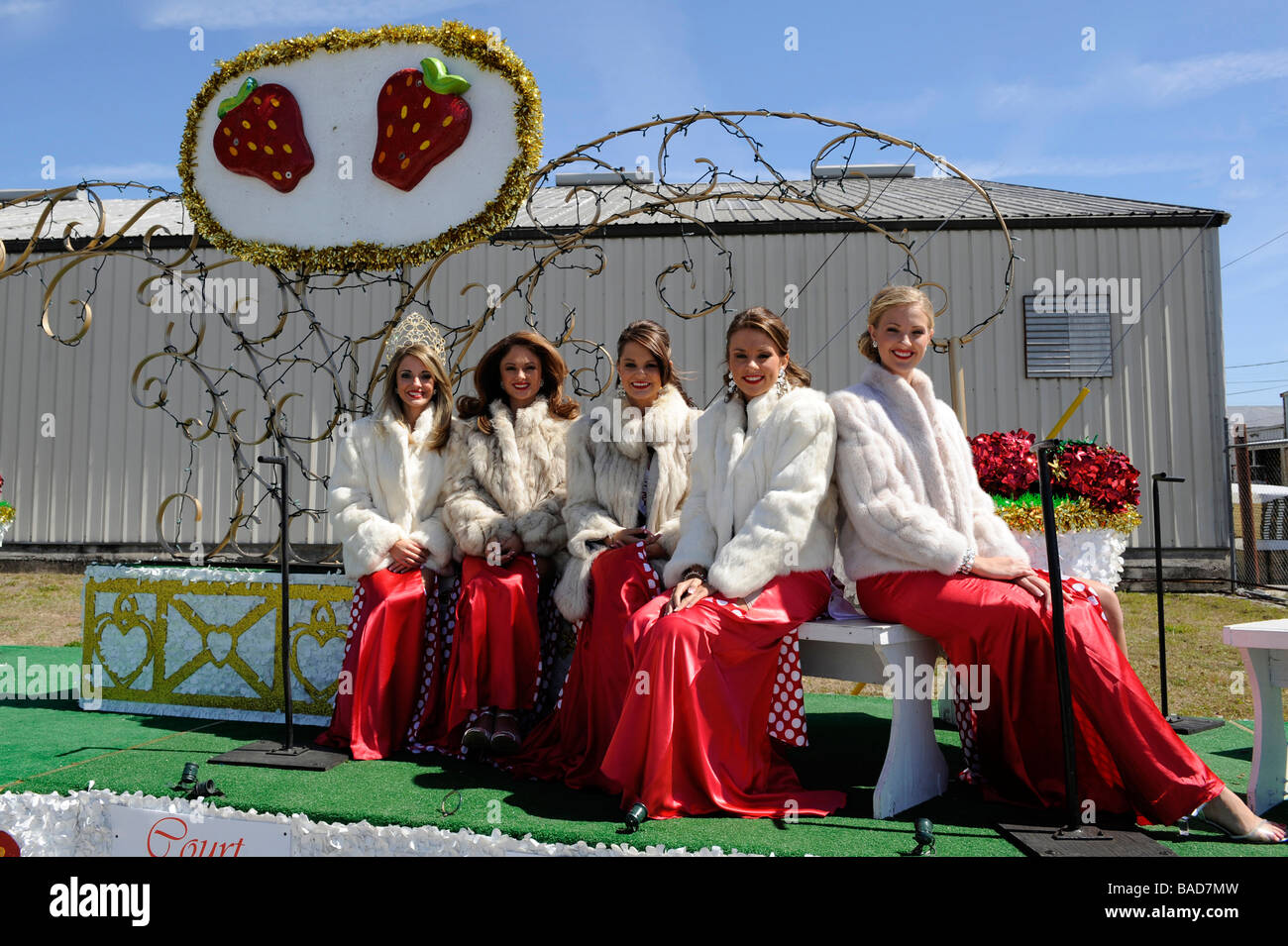 Queen and her court on float at Strawberry Festival Parade Plant City Florida Stock Photo