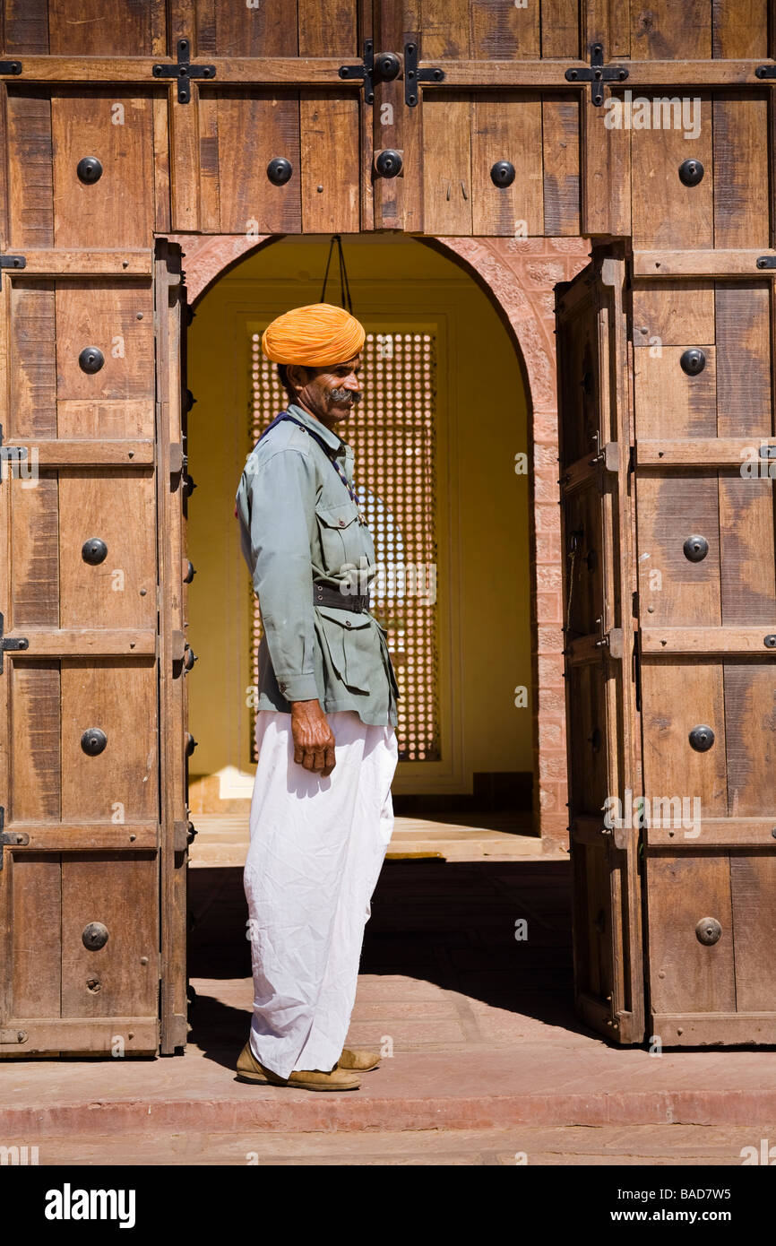 Man standing in a doorway at Osian Camel Camp, Osian, Rajasthan, India Stock Photo