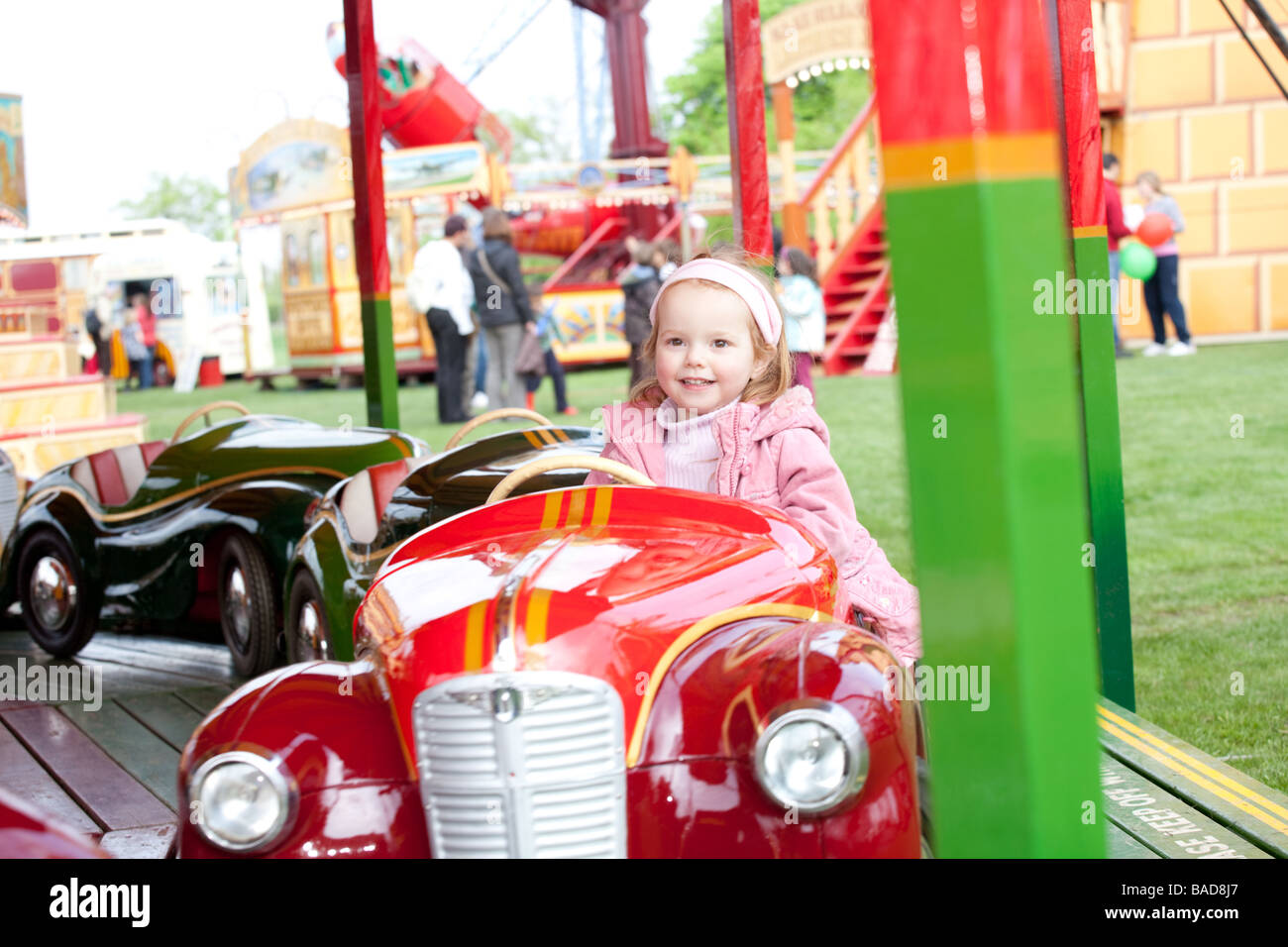 Child on a ride at a funfair Stock Photo - Alamy