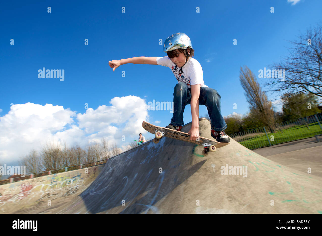 Extreme sport man in action at a concrete skate park on a skateboard Stock Photo Alamy