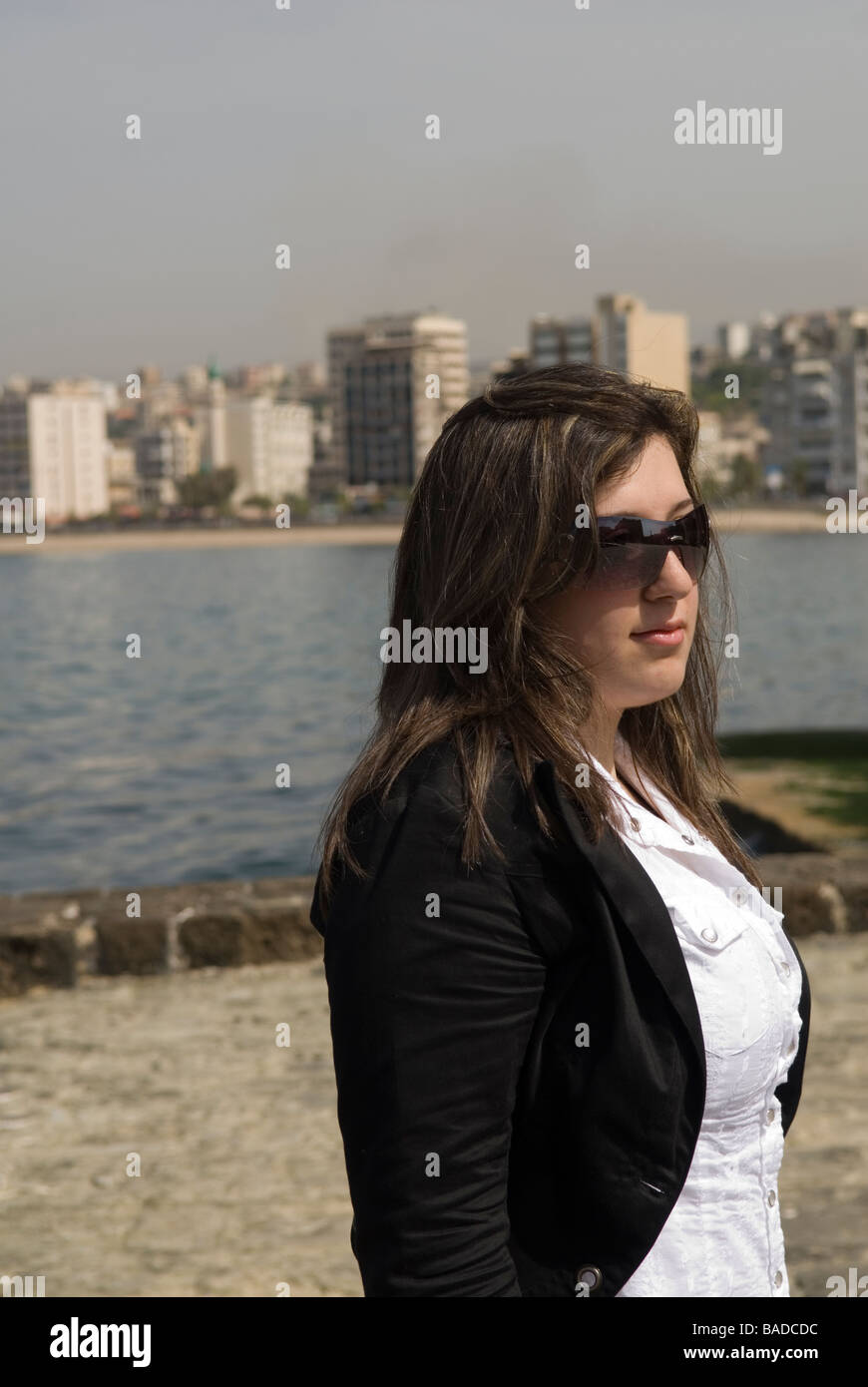 Business woman standing by the sea Stock Photo - Alamy