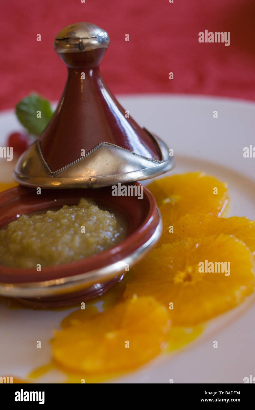 France, Orne, Alencon, Le Chapeau Rouge restaurant, orange carpaccio with  saffron syrup and olive jam, a recipe by James Stock Photo - Alamy