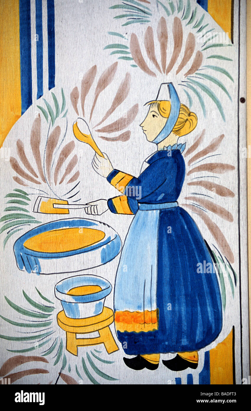 France, Finistere, Brest, painting on a creperie's sign : Bigouden doing Breton crepes (local pancakes) Stock Photo