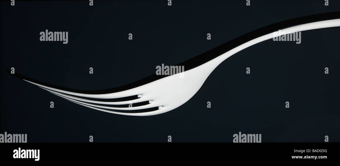 Alessi fork on black background Stock Photo