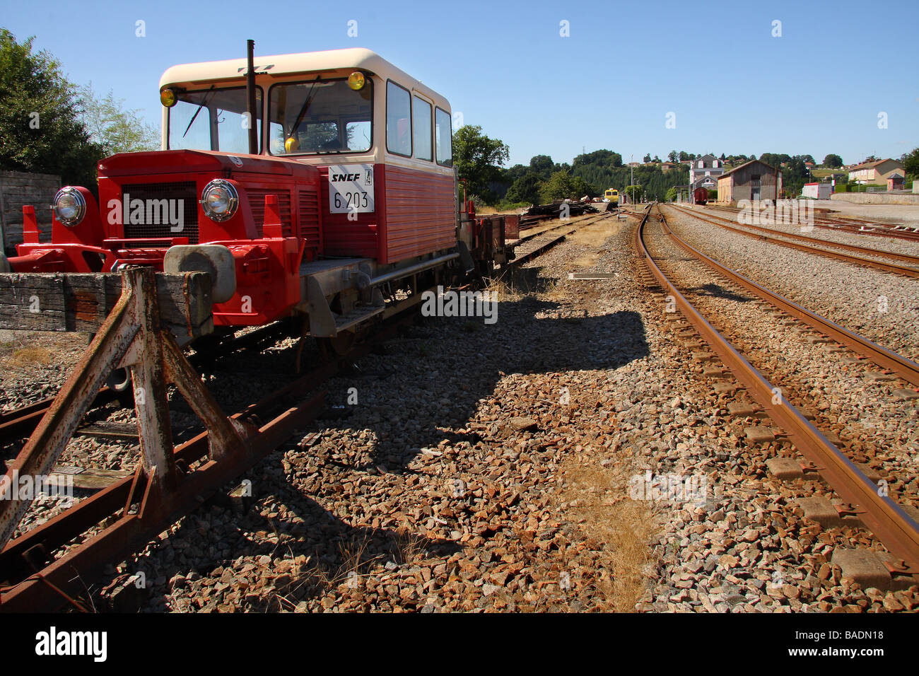 A red and cream SNCF track maintenance train in a siding Stock Photo