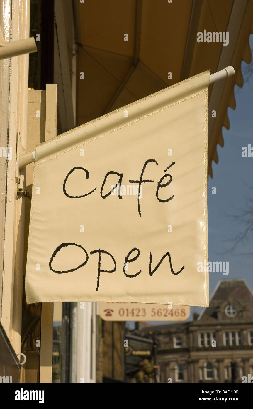 Cafe open sign Close up outside coffee shop Harrogate North Yorkshire England UK United Kingdom GB Great Britain Stock Photo