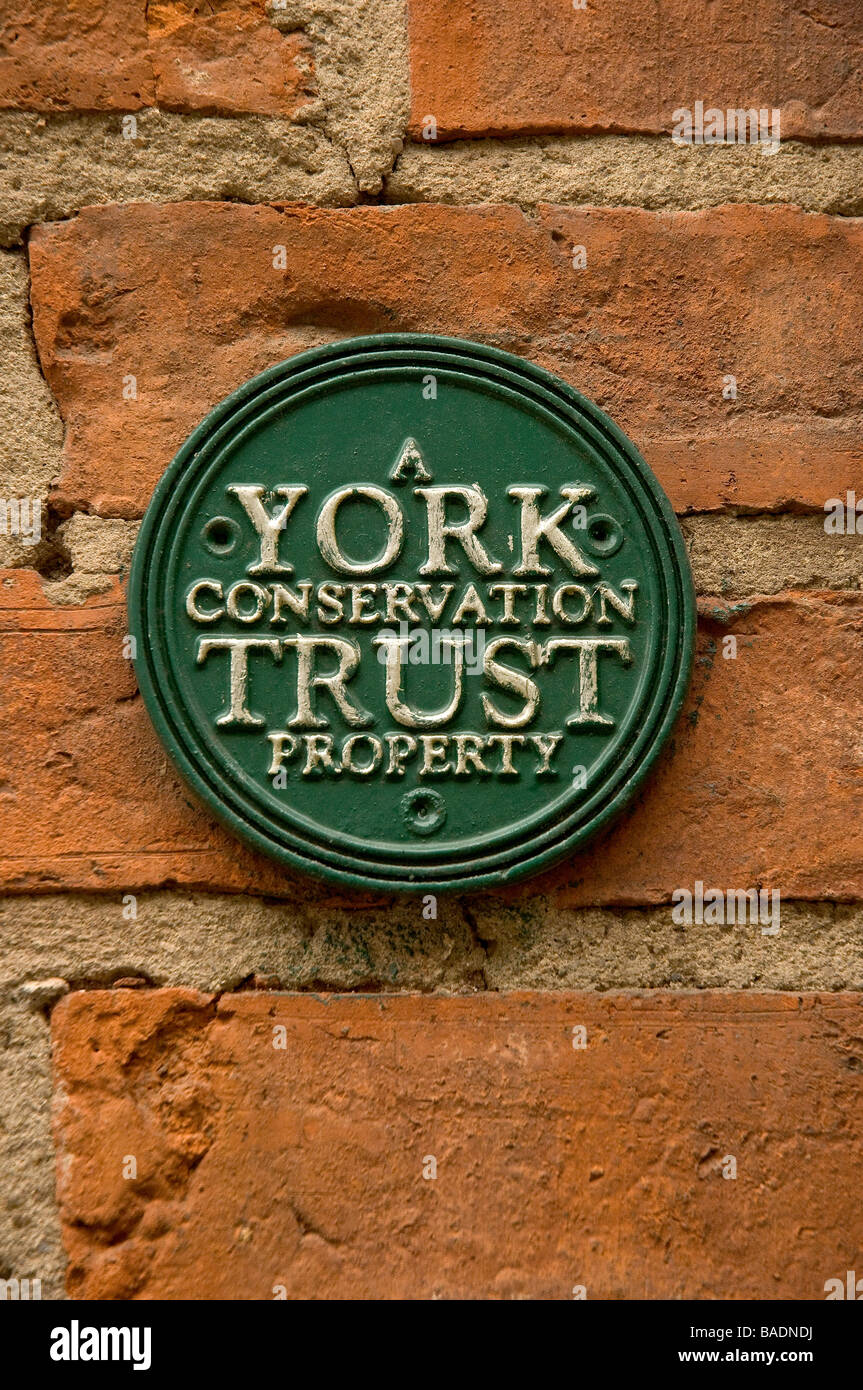 Close up of sign Plaque to indicate property owned by York Conservation Trust York North Yorkshire England UK United Kingdom GB Great Britain Stock Photo