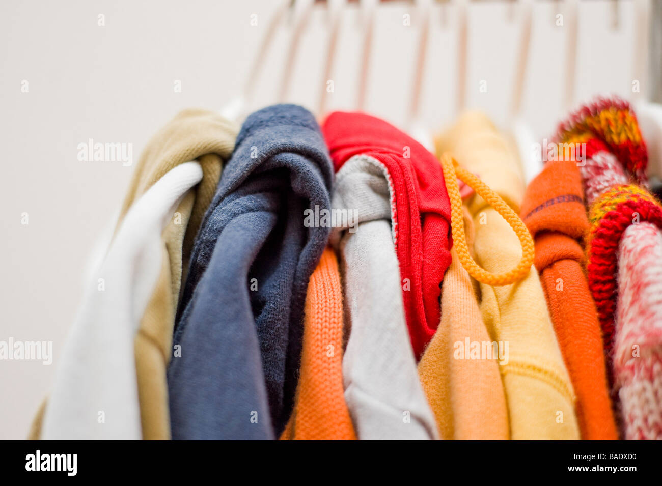 Clothes Hanging in Closet Stock Photo