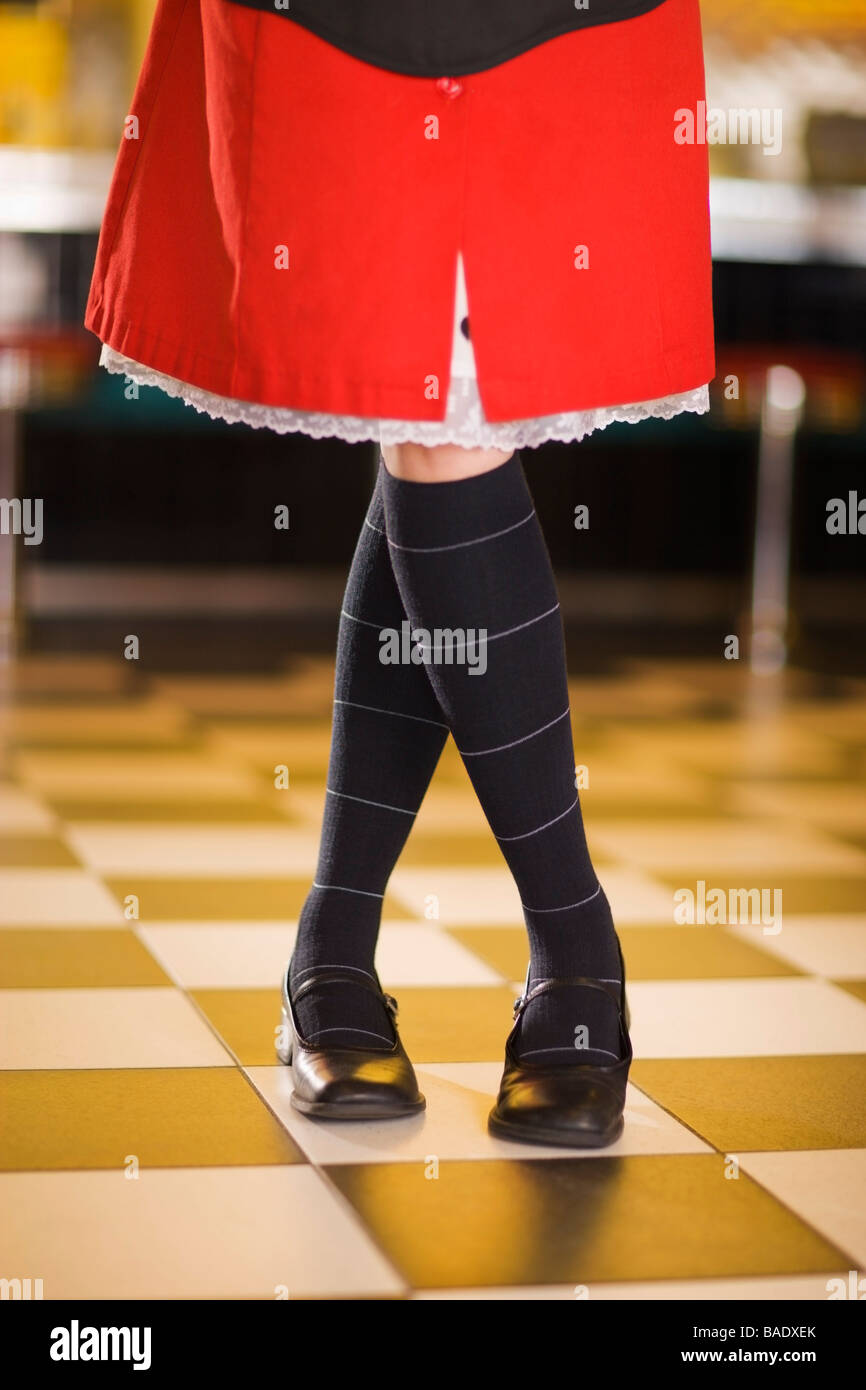 Close-up of Waitress's Legs and Skirt in a Retro Diner Stock Photo