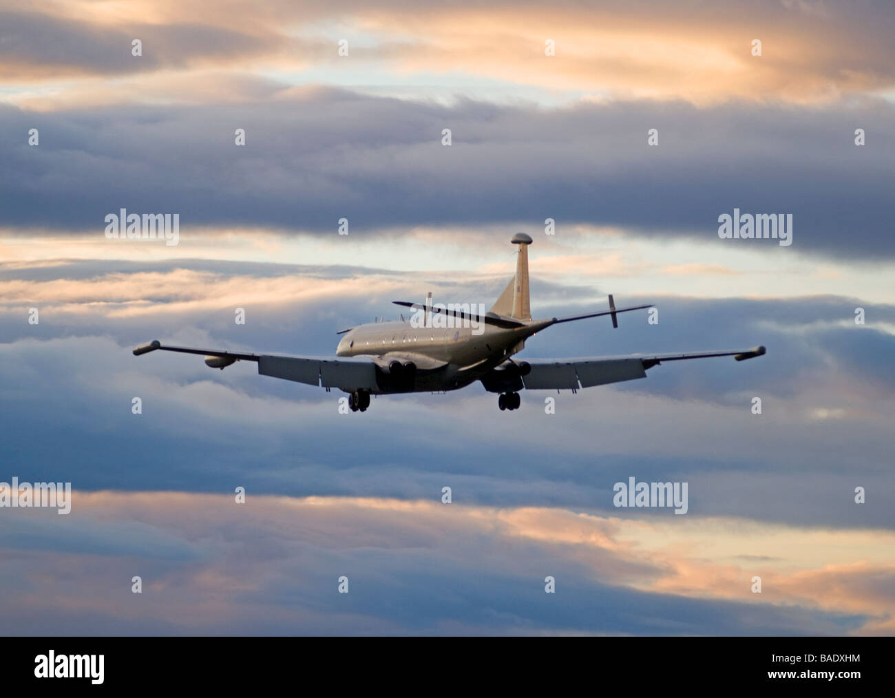 RAF Nimrod maritime patrol aircraft flys into the sunset at it base near Kinloss Morayshire Stock Photo