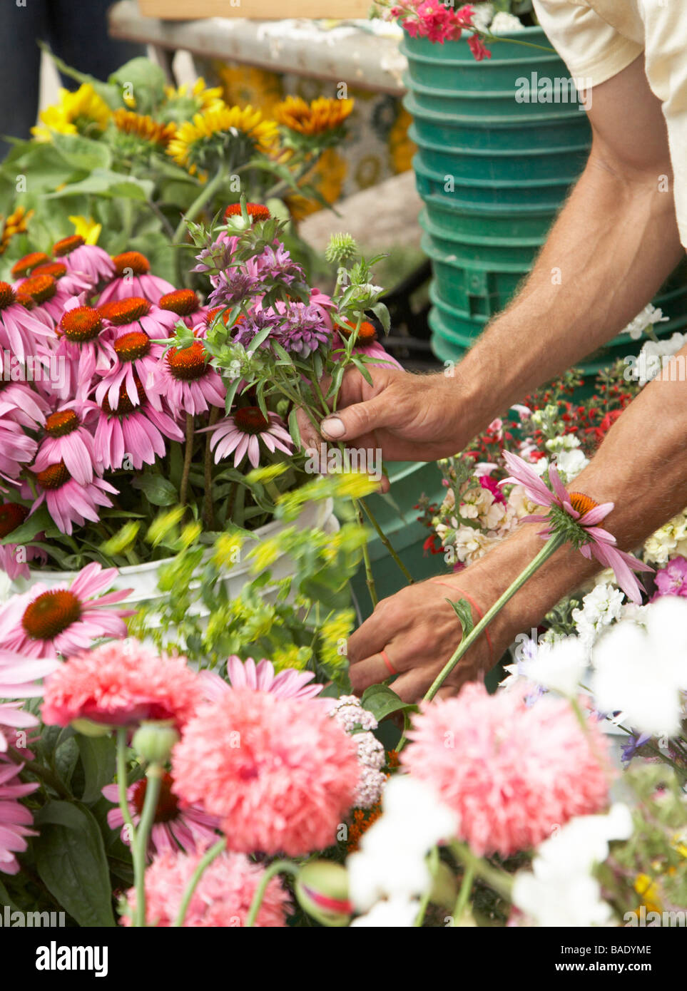 Flower Vendor Selling Flowers at Organic Farmer's market Stock Photo