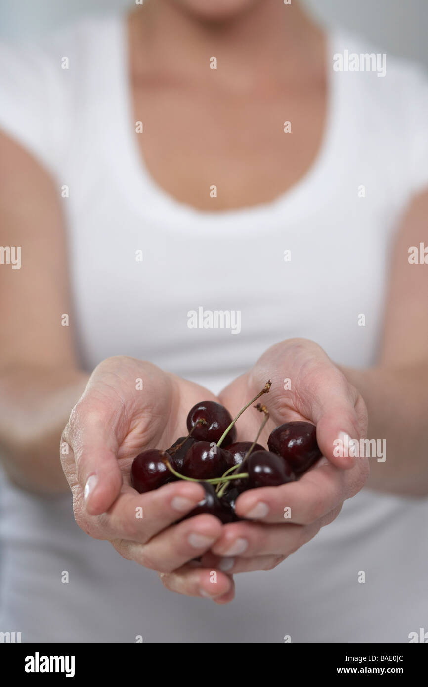 Woman Holding Cherries Stock Photo